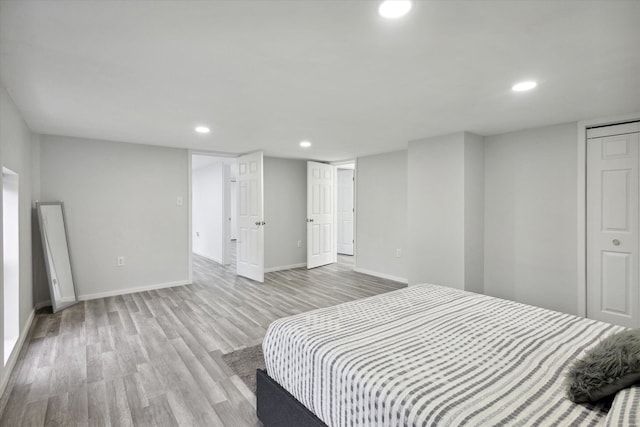 bedroom with light hardwood / wood-style flooring