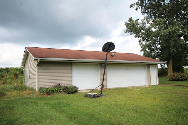 view of property exterior with a yard and a garage