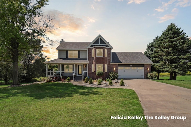 view of front of home with a porch, concrete driveway, a lawn, and an attached garage