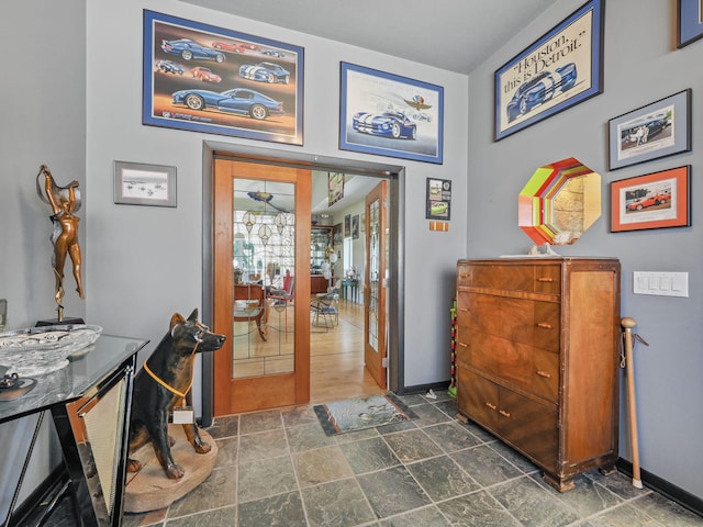 interior space with french doors and dark tile patterned floors