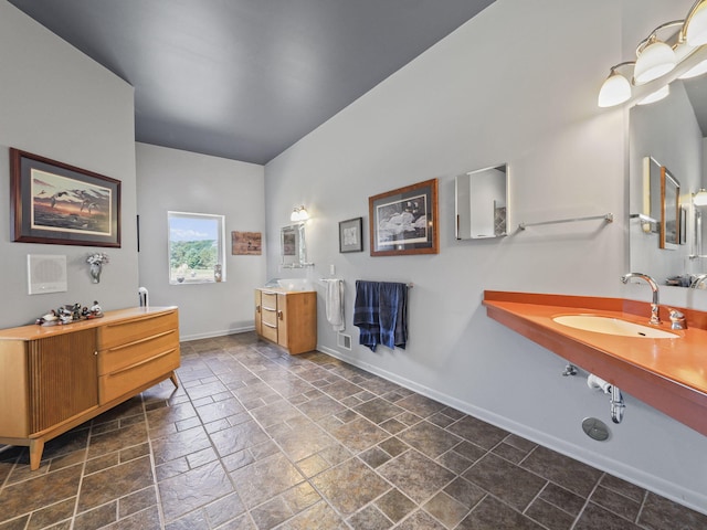 bathroom featuring tile patterned flooring and vanity