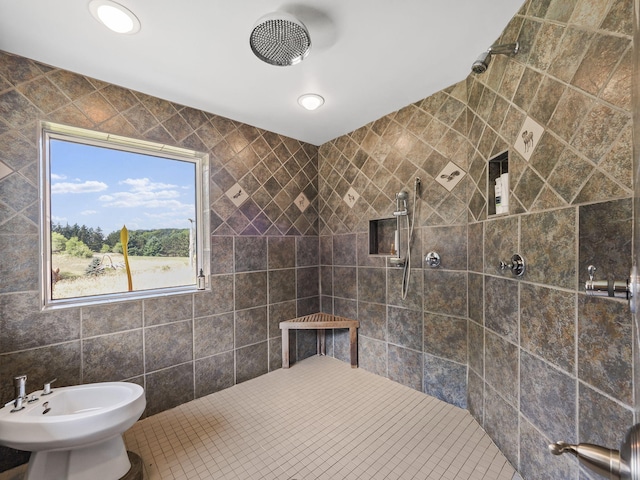 bathroom featuring tile walls, a bidet, and tiled shower