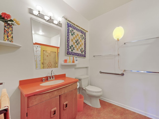 bathroom featuring toilet, vanity, and curtained shower