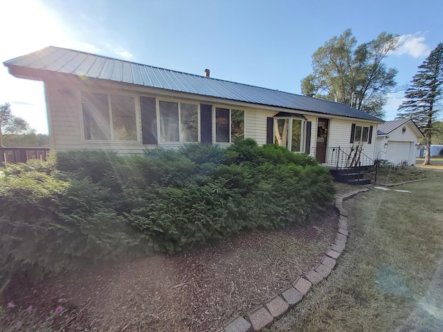 back of house featuring a garage