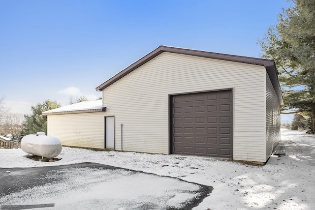 view of snow covered garage