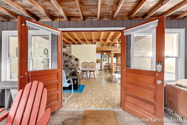 interior space featuring wooden ceiling and beamed ceiling