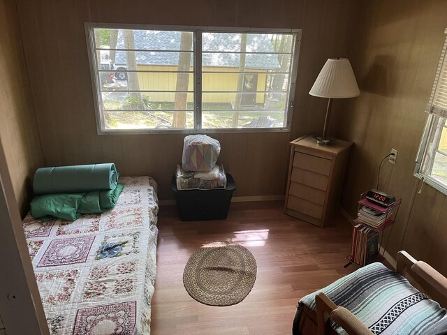 living area featuring plenty of natural light and dark hardwood / wood-style floors