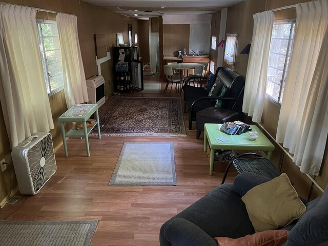 living room with a wealth of natural light and hardwood / wood-style floors