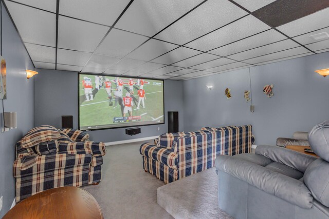 home theater room featuring carpet floors and a paneled ceiling