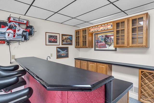 bar with a paneled ceiling