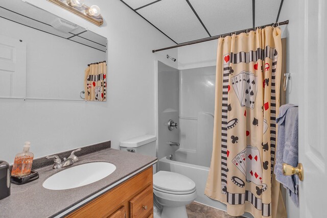 full bathroom featuring tile patterned floors, vanity, shower / bath combo, and toilet