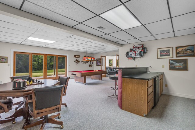 carpeted office space with a drop ceiling, pool table, french doors, and a healthy amount of sunlight