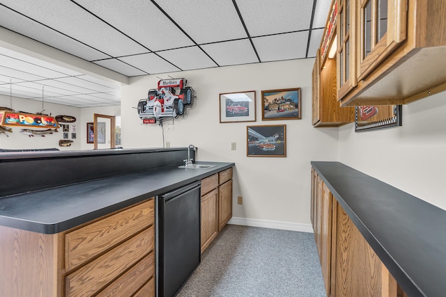 bar featuring sink, a paneled ceiling, dishwasher, and carpet floors