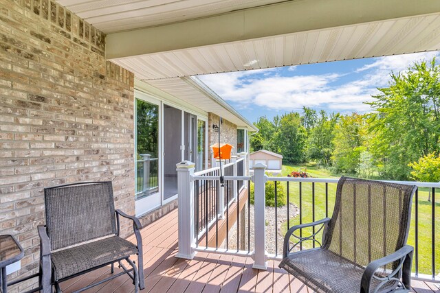 deck featuring a lawn