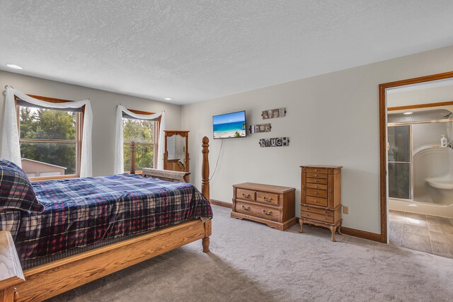 carpeted bedroom featuring a textured ceiling