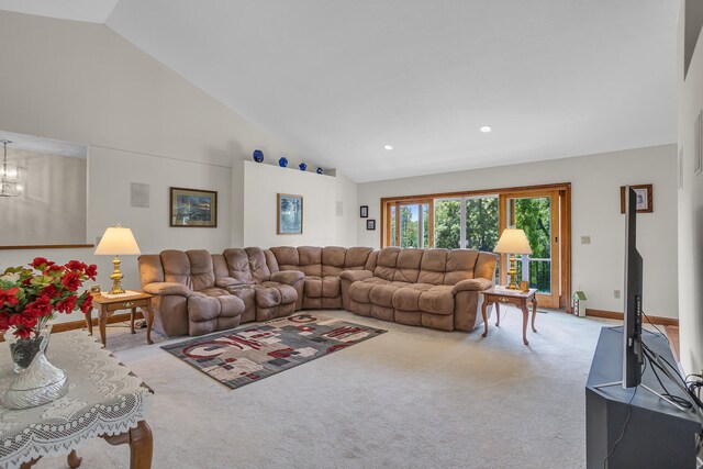 living room with carpet flooring and high vaulted ceiling