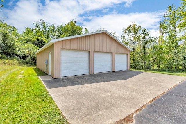 garage featuring a yard