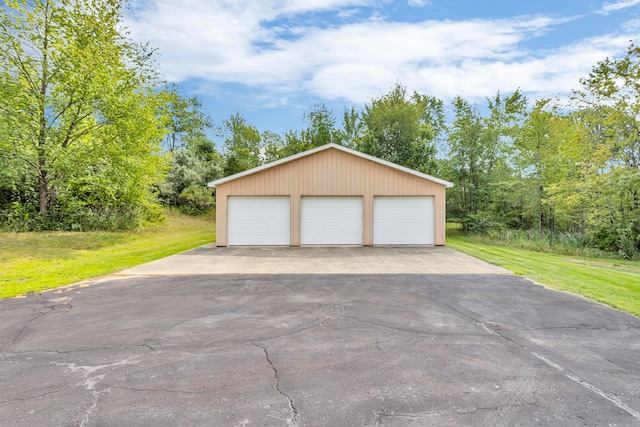 garage with a lawn