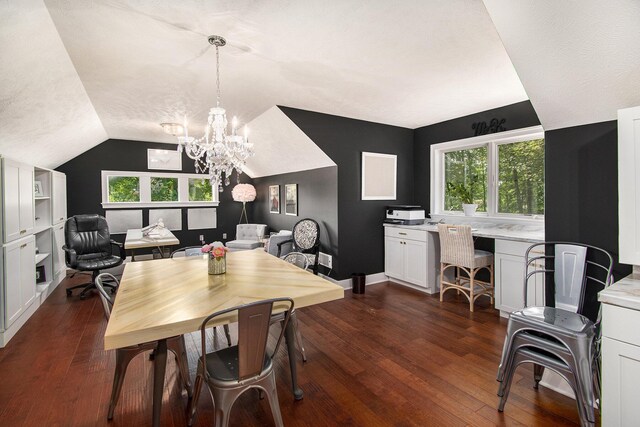 dining space featuring a notable chandelier, dark wood-type flooring, and vaulted ceiling