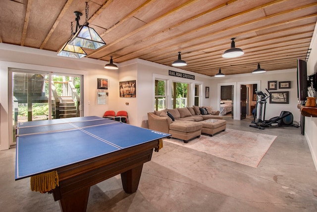 rec room with a skylight and wood ceiling