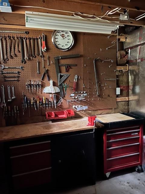 bar with concrete floors and a workshop area