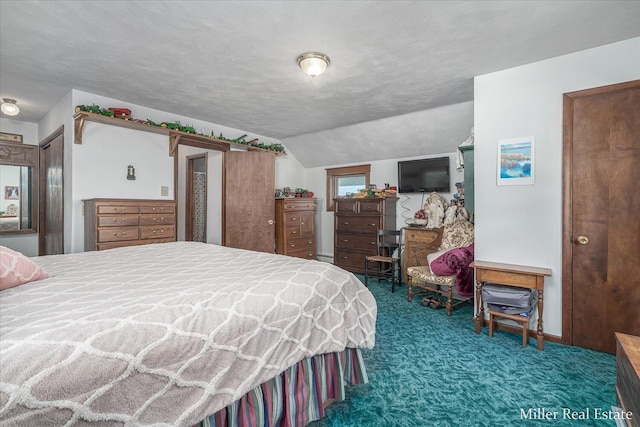 carpeted bedroom featuring a textured ceiling and vaulted ceiling