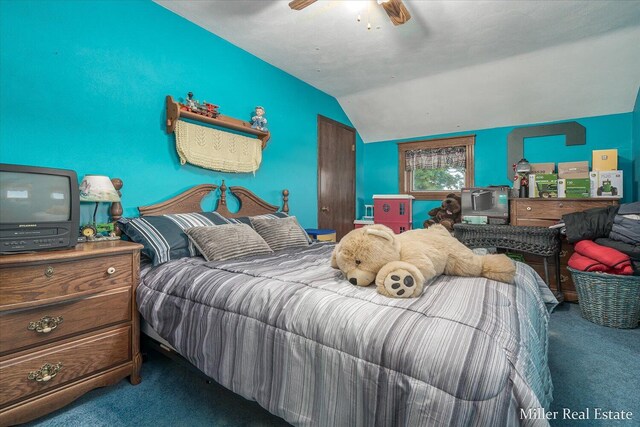 bedroom featuring ceiling fan, carpet flooring, and vaulted ceiling