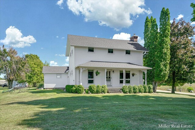 view of front of property featuring a porch, a chimney, a front lawn, and a shingled roof