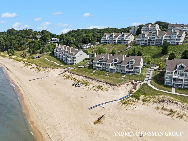 bird's eye view with a beach view and a water view