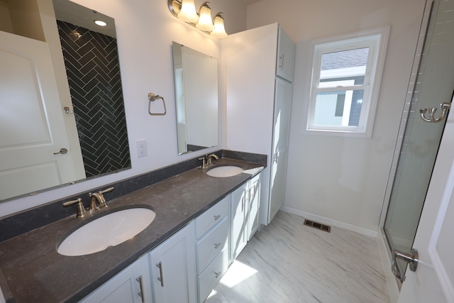 bathroom with vanity and walk in shower