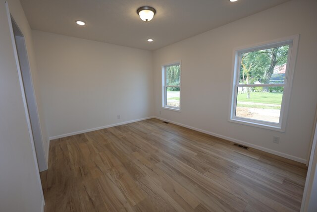 unfurnished room featuring light wood-type flooring