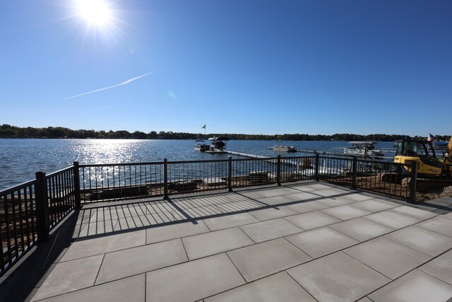 view of patio with a water view