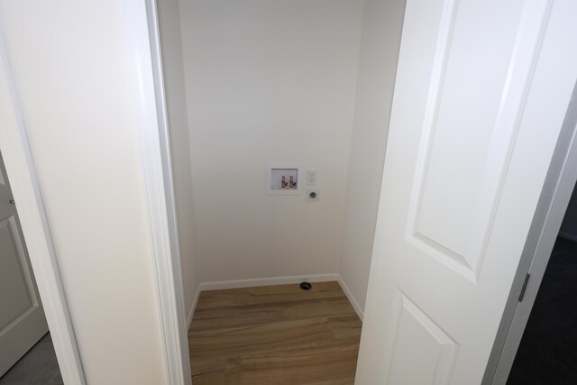 laundry room with washer hookup, dark hardwood / wood-style flooring, and electric dryer hookup