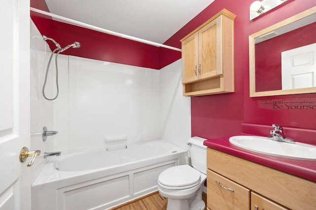 full bathroom featuring toilet, vanity, shower / bathtub combination, and hardwood / wood-style flooring