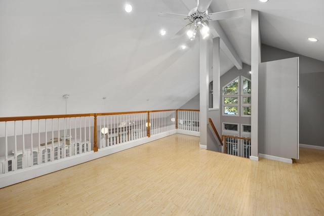 bonus room with light wood-type flooring, vaulted ceiling with beams, and ceiling fan