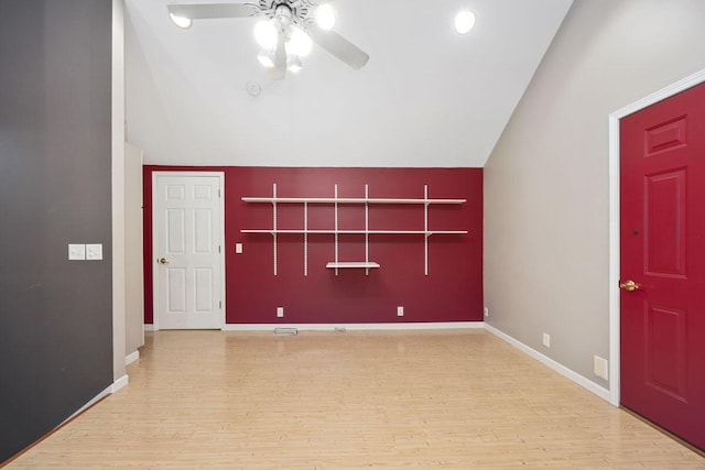 foyer entrance featuring light wood-type flooring, lofted ceiling, and ceiling fan