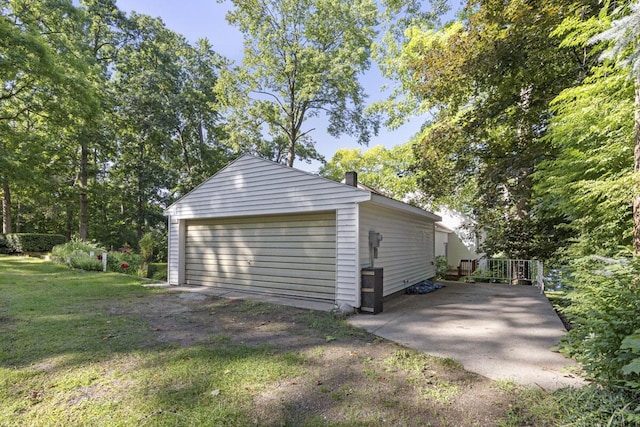 garage featuring a lawn