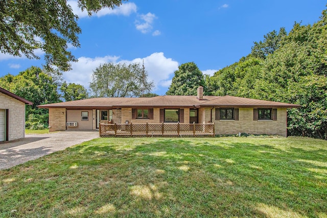 ranch-style home featuring a chimney, gravel driveway, and a front lawn