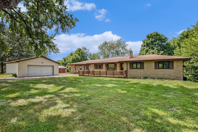 ranch-style home with a garage, a front yard, an outdoor structure, and a chimney