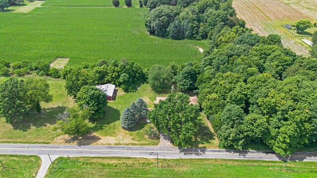 birds eye view of property with a rural view