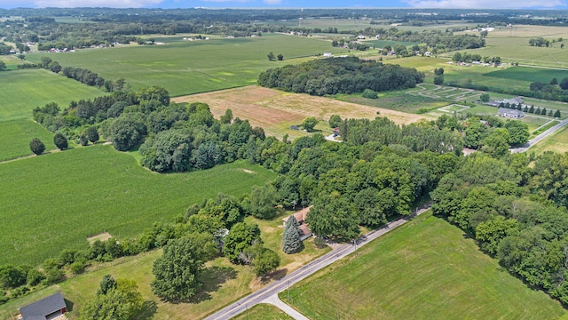 birds eye view of property with a rural view