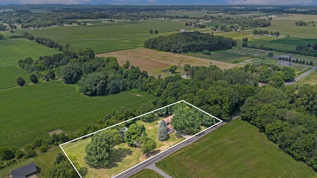 birds eye view of property with a rural view