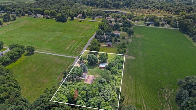 birds eye view of property with a rural view