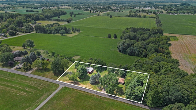 birds eye view of property featuring a rural view