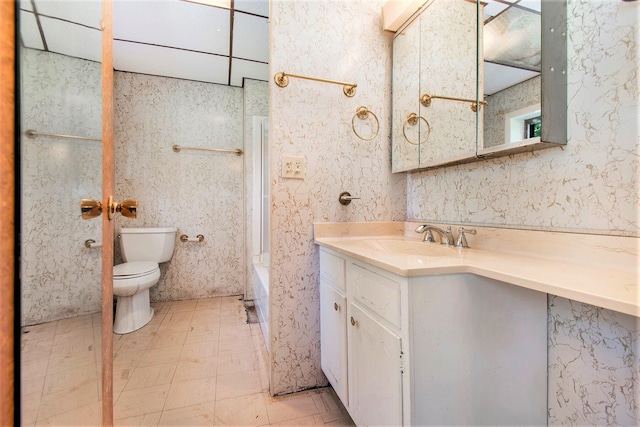 bathroom with tile patterned floors, vanity, and toilet