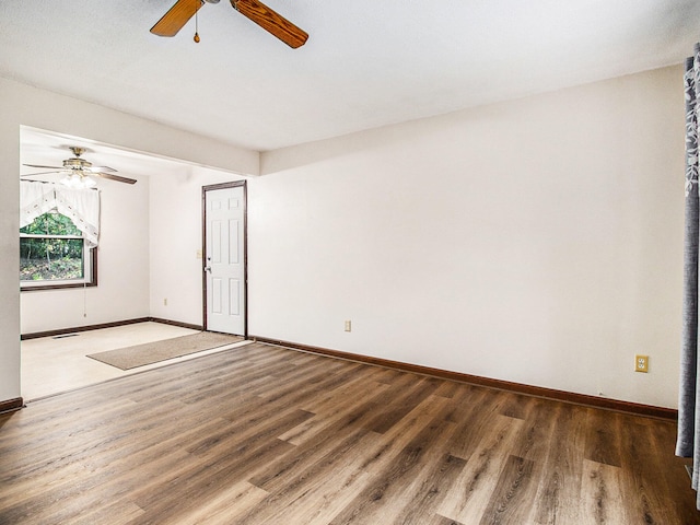 unfurnished room featuring ceiling fan and hardwood / wood-style floors