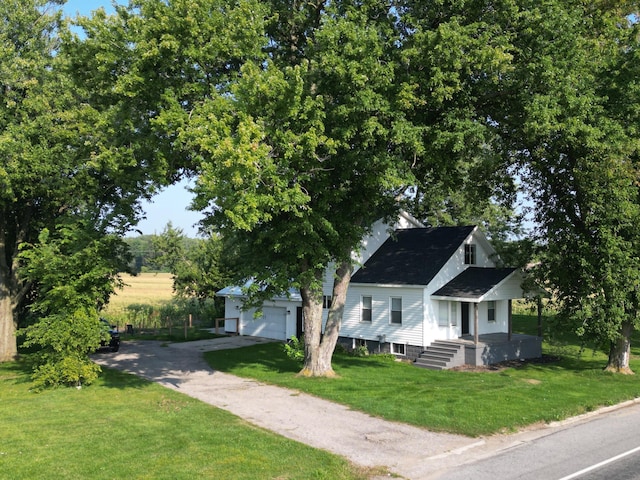 view of front of home featuring a garage and a front lawn