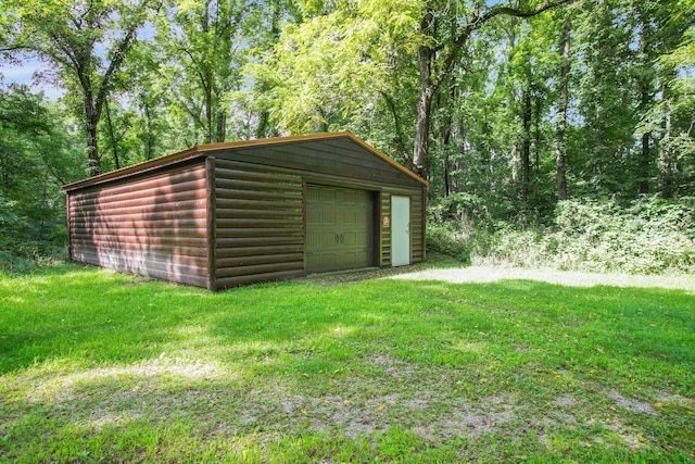 exterior space with a lawn and a garage