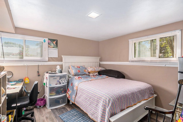 bedroom featuring wood-type flooring