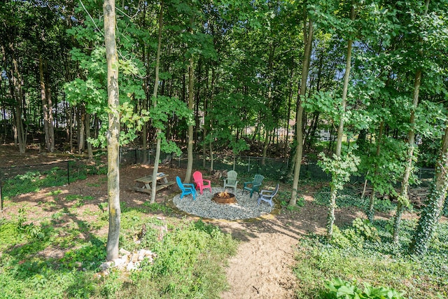 view of yard featuring an outdoor fire pit